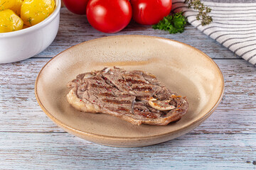 Grilled lamb steak with bone