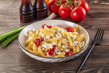 Italian pasta fusili with curd
