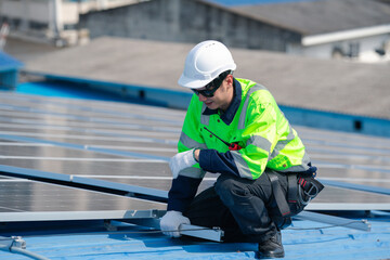Engineer man check installation solar cell on the roof of factory , Sustainable energy industry concept, Renewable energy solution for climate change