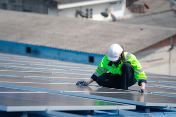Engineer man check installation solar cell on the roof of factory , Sustainable energy industry concept, Renewable energy solution for climate change