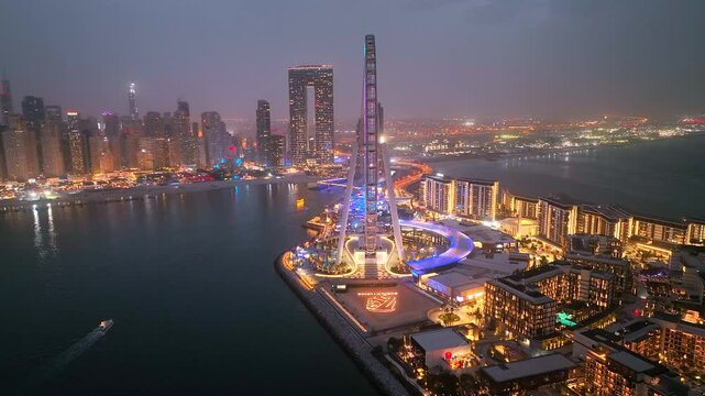 Aerial view of Bluewaters Island in Dubai Marina illuminated at night