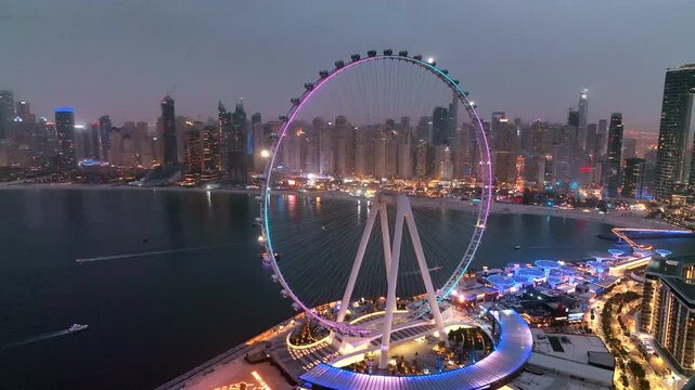 Aerial view of Bluewaters Island in Dubai Marina illuminated at night