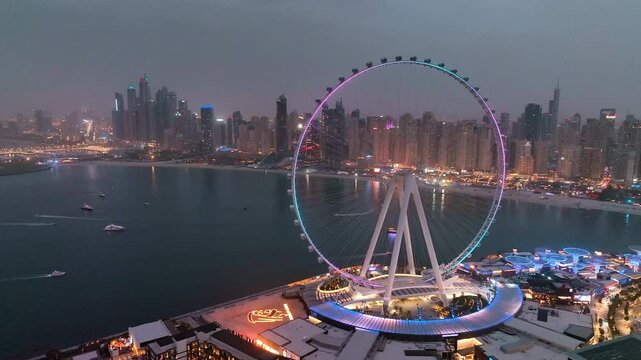 Aerial view of Bluewaters Island in Dubai Marina illuminated at night
