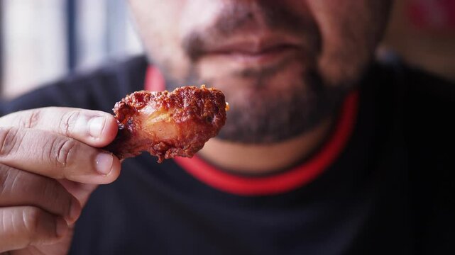Enjoying spicy chicken wings in a local eatery