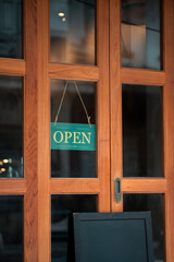 open sign hanging outside a restaurant, store, office or other