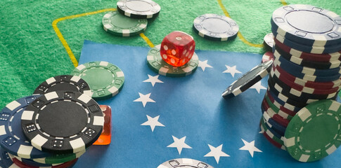 Dice, chess pieces, playing cards, wooden checkers and dominoes for board games on a light table. flag of the European Union