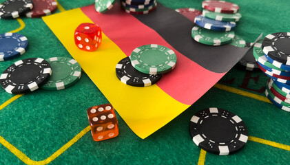 Chips from casino. germany flag. Gambling industry in germany. Casino chips are scattered on steel. Gambling business. Casinos. Gambling. Poker, roulette. 