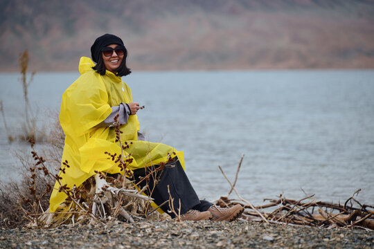 Woman enjoys fishing on a rainy day