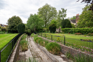 Beautiful view to old historic green garden in Lewes village, UK © Cavan