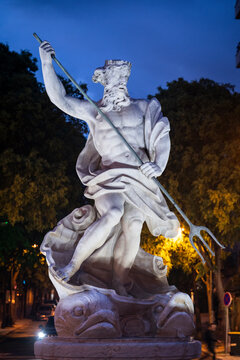 Beautiful neptune god statue in downtown Lisbon, Portugal