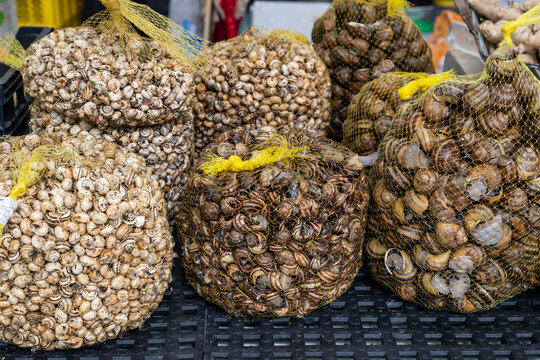 Snails for sale in traditional Arroios Market building