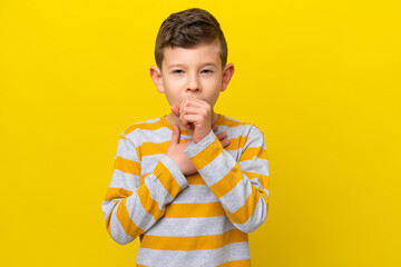 Little caucasian boy isolated on yellow background coughing a lot