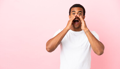 African American man on copyspace pink background shouting and announcing something