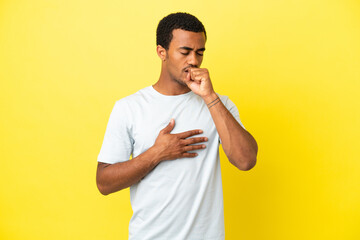 African American handsome man on isolated yellow background coughing a lot