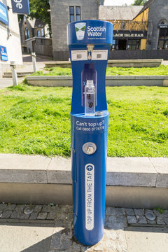 Fort William, Scotland, United Kingdom - August 17, 2023: Public water dispenser providing free drinking water in Scotland. Sustainable bottle filling system.