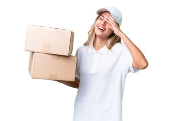 Delivery Uruguayan woman over isolated background smiling a lot