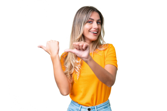 Young Uruguayan woman over isolated background pointing to the side to present a product