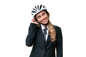 Business Uruguayan woman wearing a helmet biker over isolated background thinking an idea