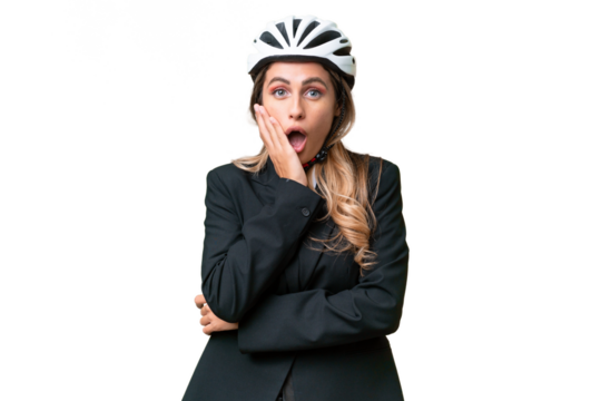 Business Uruguayan woman wearing a helmet biker over isolated background surprised and shocked while looking right