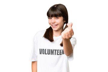 Little volunteer girl over isolated background making money gesture