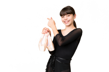 Little caucasian girl practicing ballet over isolated background pointing back