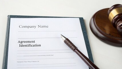 Legal, tax, and agreement concept. Legal document with a pen and judge's gavel on a table.