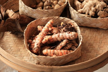 Kunyit or Turmeric Root on Besek or Bamboo Weaving Box Basket