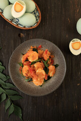 Deep Fried Crispy Shrimp Prawn with Salted Egg Sauce with Curry Leaves.