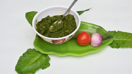 Indian Spinach and Potato Curry. Indian vegetable curry with spinach and potato. A dry dish made from fried potatoes and spinach in Indian style. 
