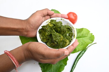 Indian Spinach and Potato Curry. Indian vegetable curry with spinach and potato. A dry dish made from fried potatoes and spinach in Indian style. 
