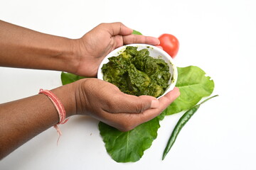 Indian Spinach and Potato Curry. Indian vegetable curry with spinach and potato. A dry dish made from fried potatoes and spinach in Indian style. 
