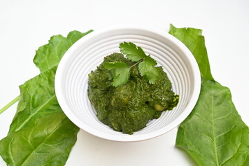 Indian Spinach and Potato Curry. Indian vegetable curry with spinach and potato. A dry dish made from fried potatoes and spinach in Indian style. 
