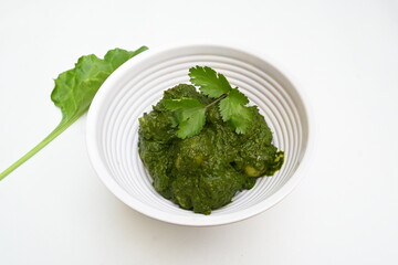 Indian Spinach and Potato Curry. Indian vegetable curry with spinach and potato. A dry dish made from fried potatoes and spinach in Indian style. 
