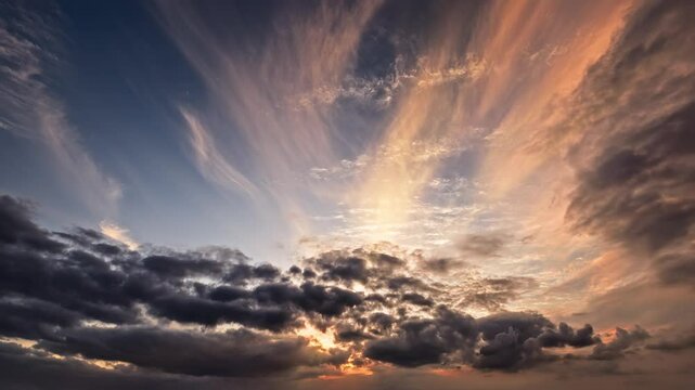Time lapse of dramatic colorful clouds moving across the sky during a beautiful sunset creating an atmospheric background.