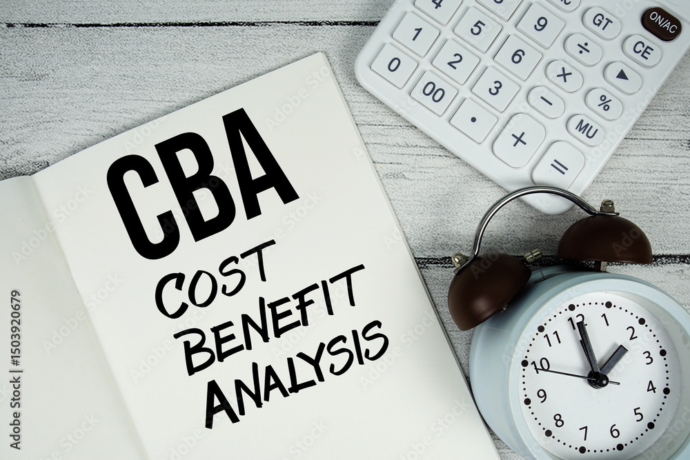 Poster cba cost benefit analysis text on paper notebook page with alarm clock and calculator on wooden back