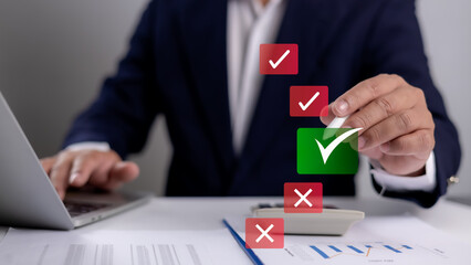 Hand man presses a green checkmark on a digital document, symbolizing approval, validation, and...