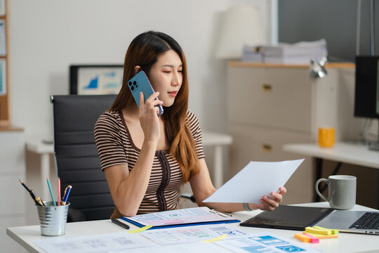 woman developer or designer thinking about mobile app interface wireframe design with customer breif and color code at office..