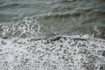 Aerial View of Ocean Waves and Foam