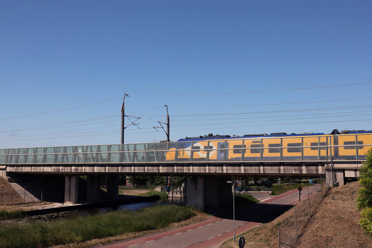 Eurocity direct train on High speed line viaduct where speed reduced due to construction fault by Rijkswaterstaat
