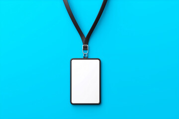 blank name tag on lanyard – top view on blue background