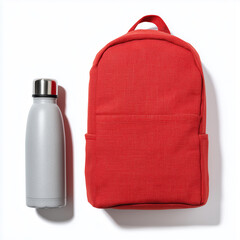Red Canvas Backpack and Grey Water Bottle on White Background