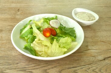 mixed vegetable salad on plate dressing chop chicken in Japanese sesame cream sauce