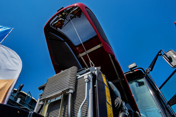 The Powerful Front End of a Modern Tractor Under a Brilliant Blue Sky Represents Innovation
