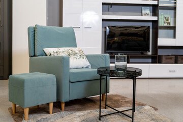 Cozy Living Room with Comfortable Armchair and Ottoman