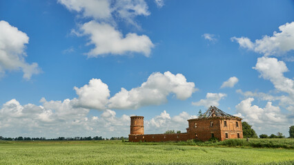 ruins of an old castle against a background of blue sky and clouds. Historical buildings in Belarus.