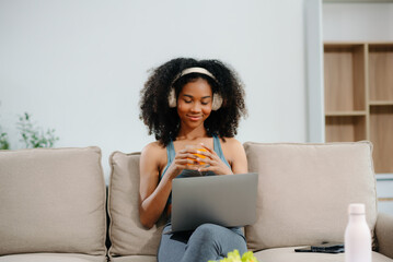 Woman enjoys a fresh salad with fruits and juice, embodying wellness, nutrition, and vitality