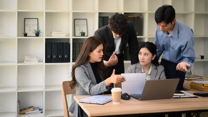 Fototapeta premium Serious Business Team Analyzing Documents in an Office Meeting