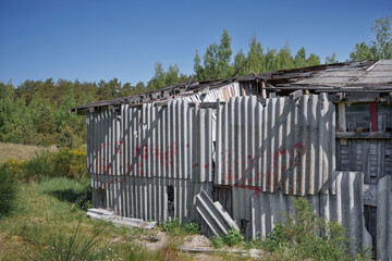 Old and very dangerous asbestos roof. Asbestos dust in the environment. Asbestos removal