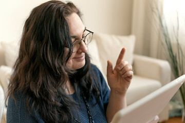 woman shopping online via tablet