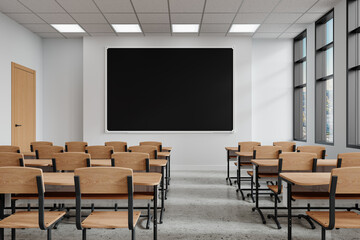 Empty classroom with desks and a blackboard